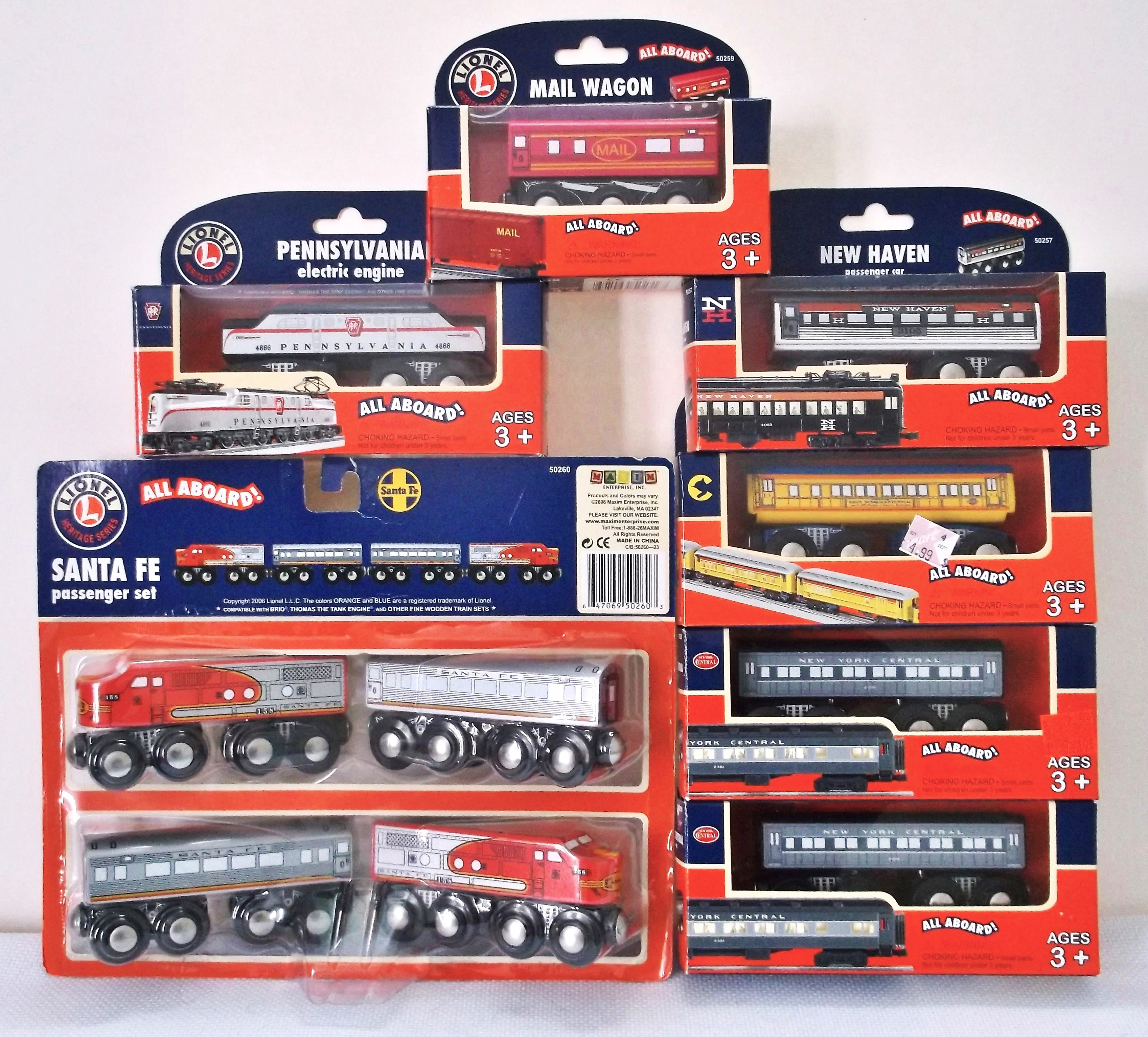 Fig. 5– Photo of Maxim-Lionel collaboration sets 2006-2007.  Note the corresponding electric trains on the box art.