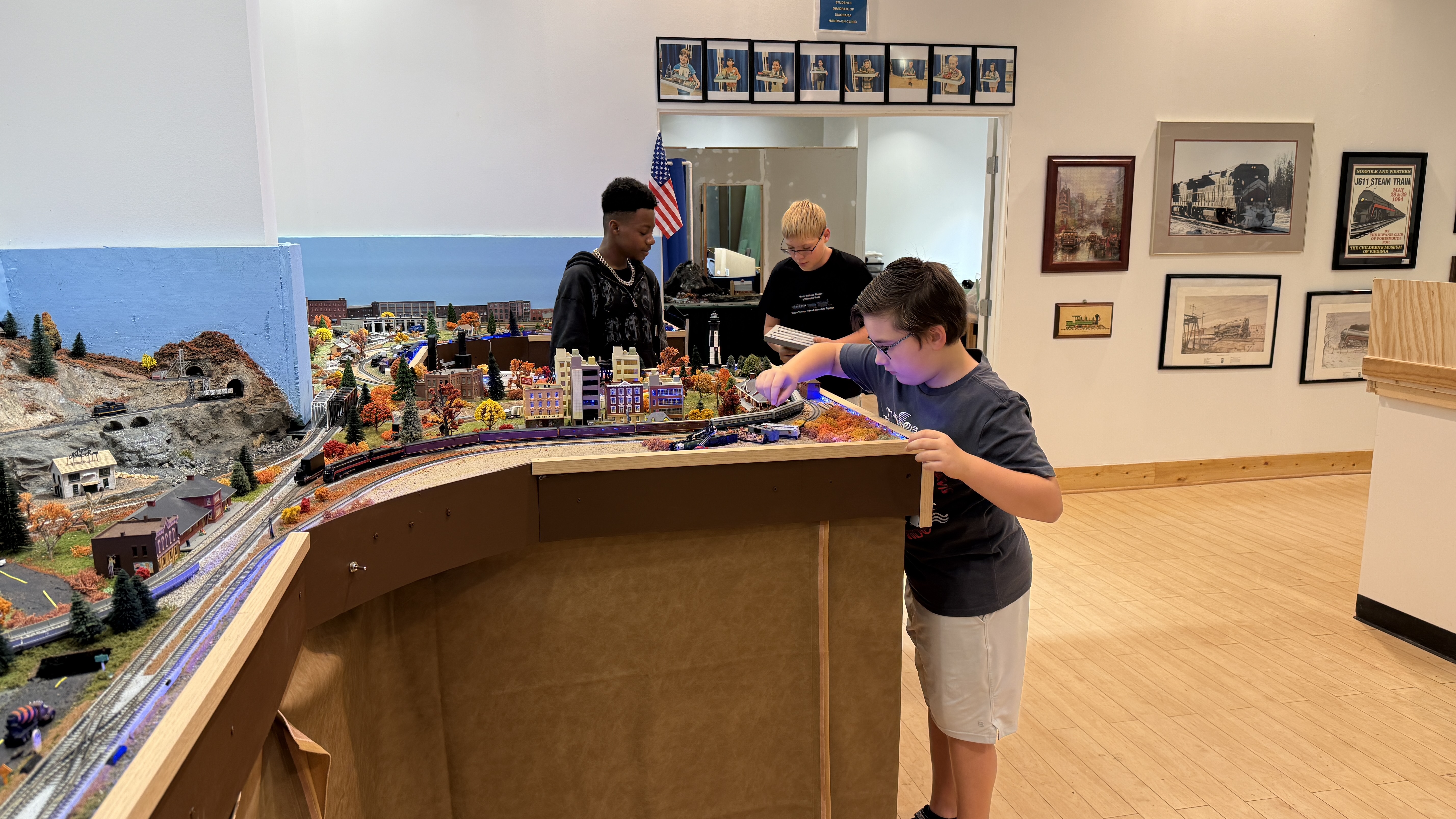 Teens working on an N scale layout
